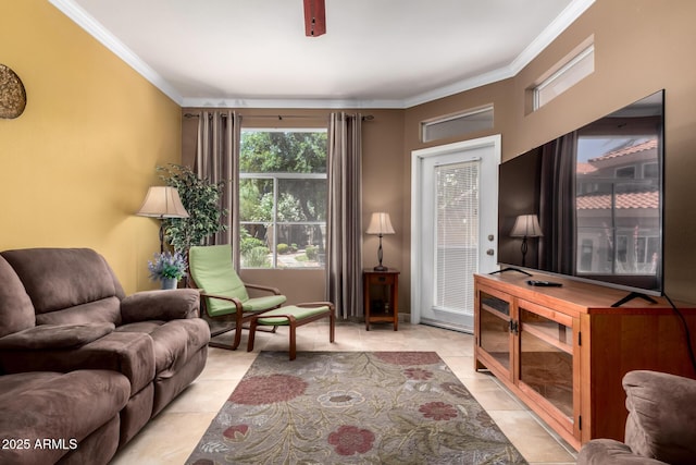 sitting room with light tile patterned floors and ornamental molding