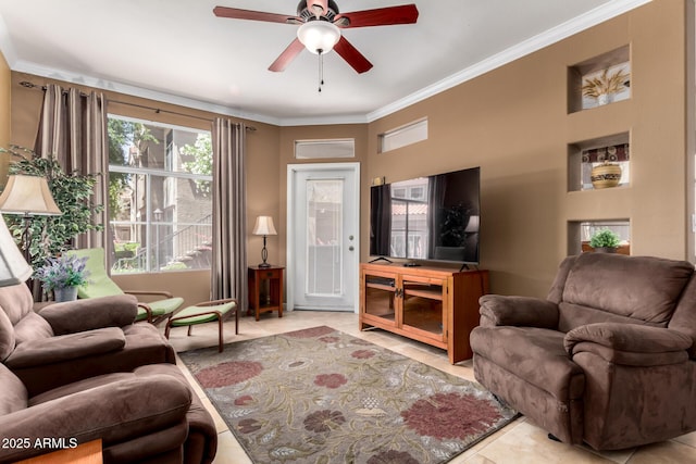 tiled living room featuring crown molding and a ceiling fan