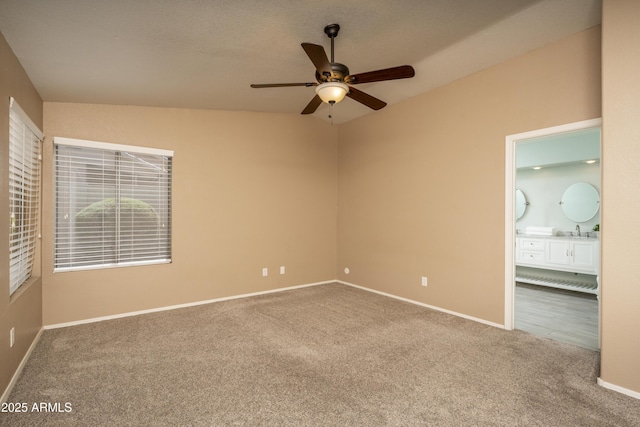 12044 S 45th St, Phoenix, AZ 85044 - unfurnished bedroom featuring carpet floors, baseboards, a sink, ensuite bath, and ceiling fan