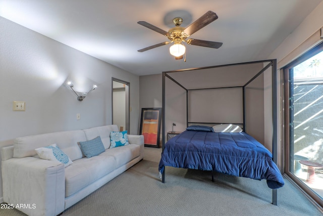 bedroom with a ceiling fan and carpet flooring