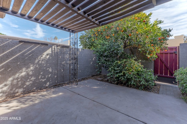 view of patio / terrace with a gate and fence