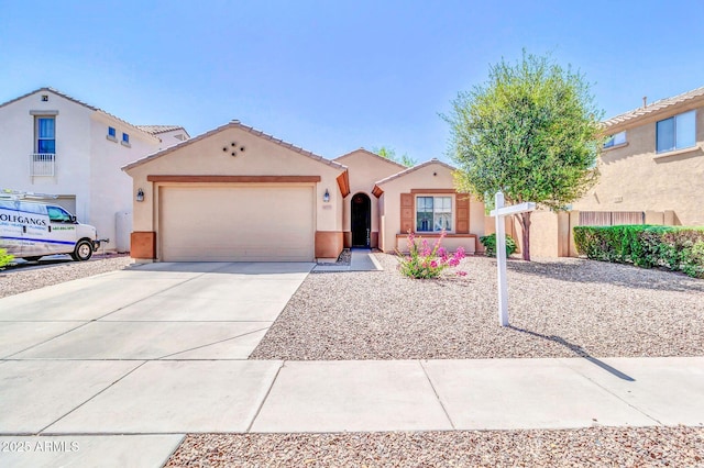 4323 S Ranger Trl, Gilbert, AZ 85297 - mediterranean / spanish-style house with an attached garage, concrete driveway, stucco siding, and a tile roof