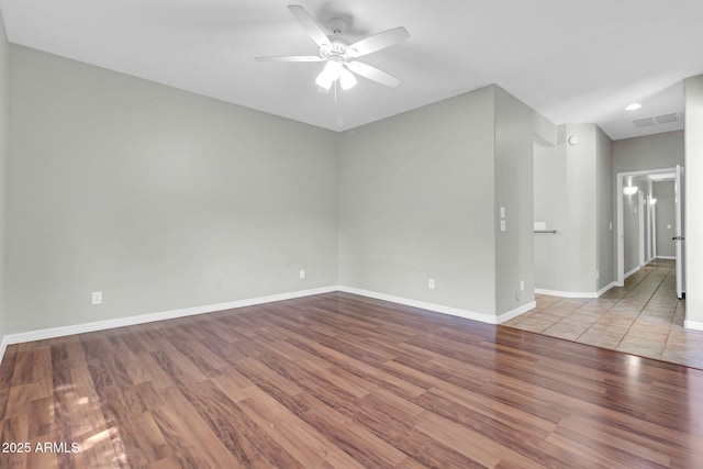 4323 S Ranger Trl, Gilbert, AZ 85297 - empty room with wood finished floors, ceiling fan, baseboards, and recessed lighting