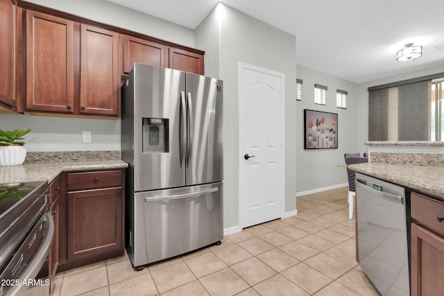 4323 S Ranger Trl, Gilbert, AZ 85297 - kitchen with appliances with stainless steel finishes, baseboards, and light tile patterned floors