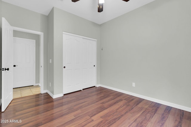 4323 S Ranger Trl, Gilbert, AZ 85297 - unfurnished bedroom with wood finished floors, a closet, baseboards, and a ceiling fan