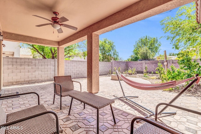 4323 S Ranger Trl, Gilbert, AZ 85297 - fenced backyard featuring a ceiling fan and a patio