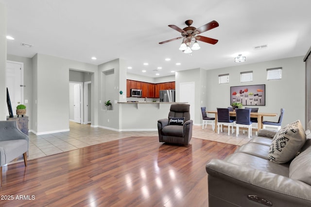 4323 S Ranger Trl, Gilbert, AZ 85297 - living area featuring ceiling fan, light wood-style floors, recessed lighting, and baseboards