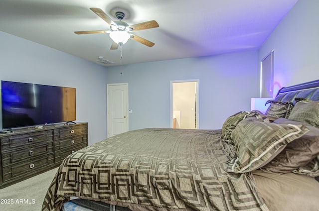 bedroom with a ceiling fan and carpet