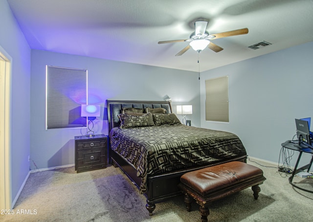 carpeted bedroom featuring baseboards, visible vents, and ceiling fan