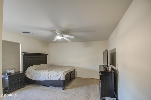 bedroom with light carpet, visible vents, and ceiling fan