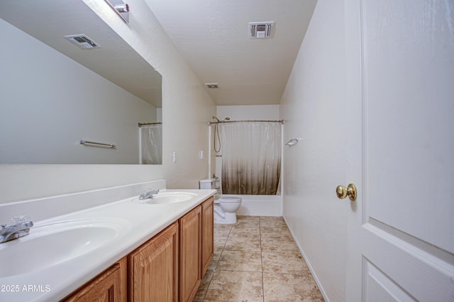 bathroom with a sink, visible vents, and toilet