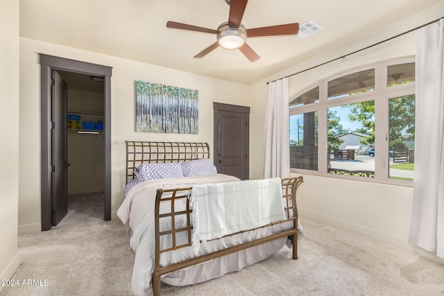 5039 S 158th St, Gilbert, AZ 85298 - carpeted bedroom with a walk in closet, baseboards, ceiling fan, and visible vents