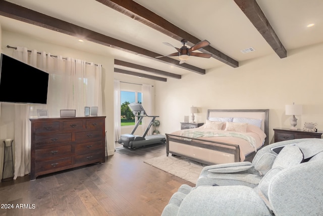 bedroom featuring dark hardwood / wood-style floors, beam ceiling, and ceiling fan