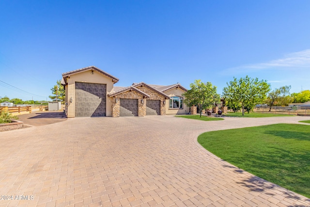 view of front of house with a front lawn and a garage