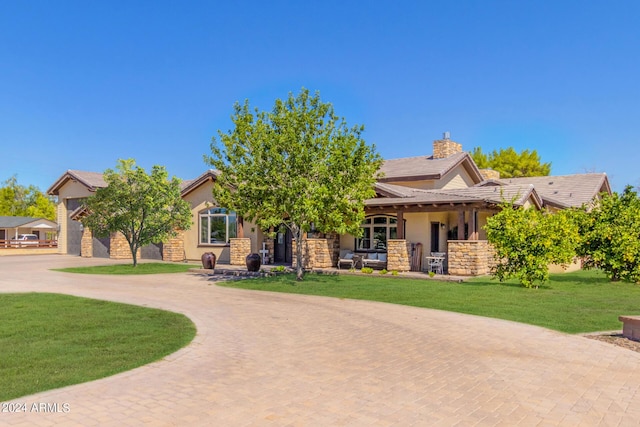 5039 S 158th St, Gilbert, AZ 85298 - view of front of property featuring a front lawn, curved driveway, stucco siding, a chimney, and a tile roof