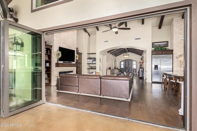 5039 S 158th St, Gilbert, AZ 85298 - living area with ceiling fan, beam ceiling, arched walkways, a large fireplace, and visible vents