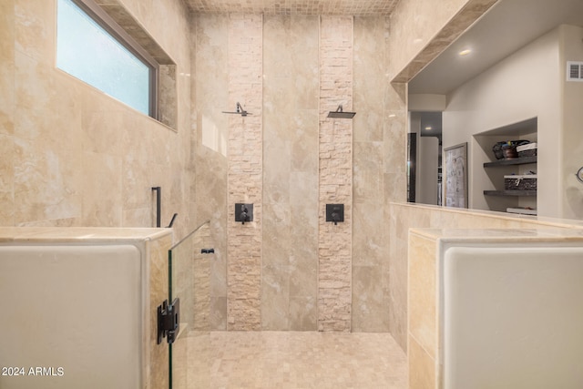 bathroom featuring tiled shower