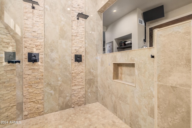 bathroom featuring tiled shower