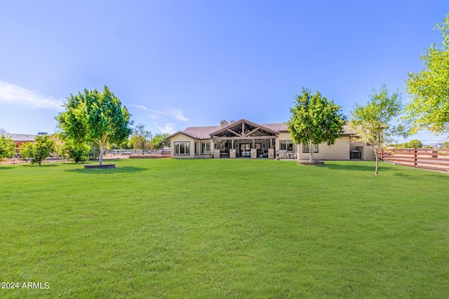 5039 S 158th St, Gilbert, AZ 85298 - back of house featuring fence and a lawn