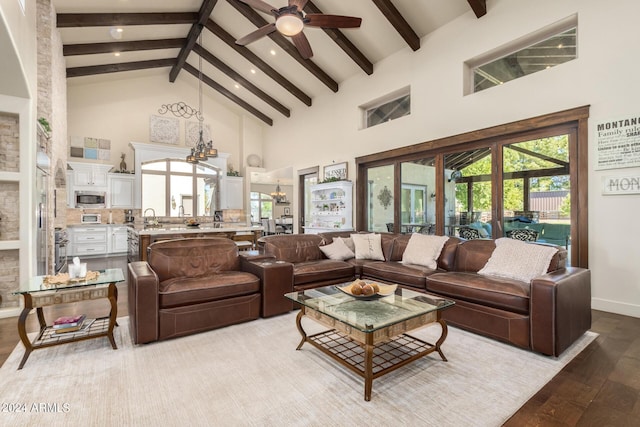 5039 S 158th St, Gilbert, AZ 85298 - living room featuring beam ceiling, ceiling fan with notable chandelier, wood finished floors, and high vaulted ceiling