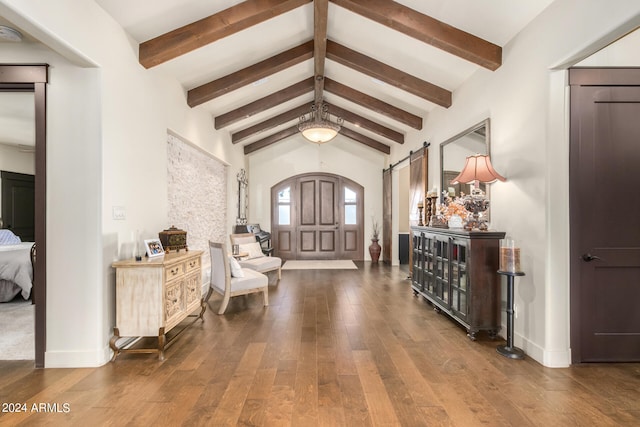 entrance foyer featuring vaulted ceiling with beams and hardwood / wood-style floors