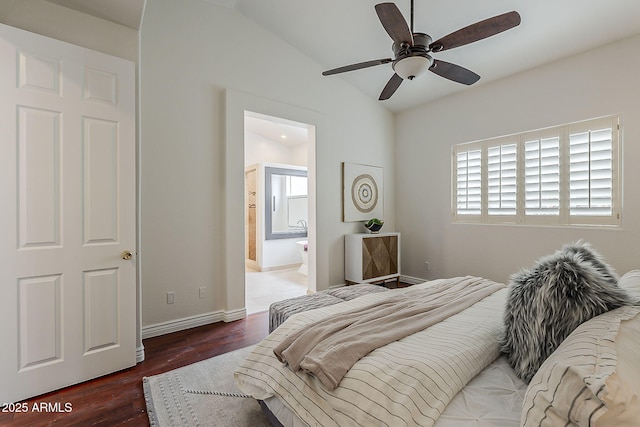 bedroom featuring multiple windows, vaulted ceiling, and wood finished floors