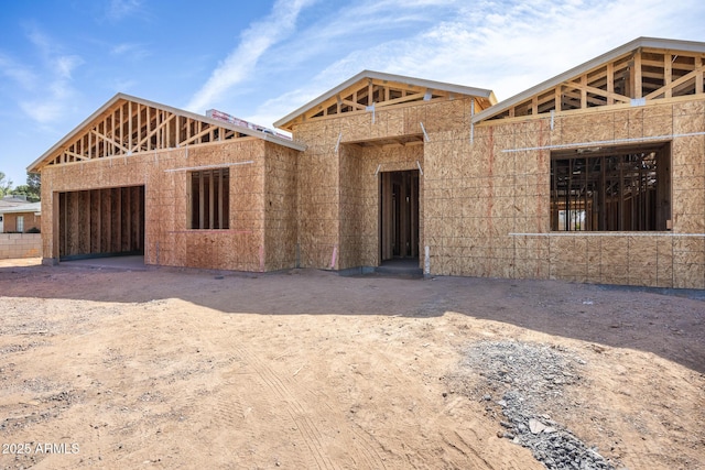 unfinished property with a garage