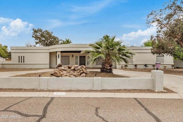 12821 N 67th St, Scottsdale, AZ 85254 - view of front of property featuring concrete driveway, stucco siding, and fence
