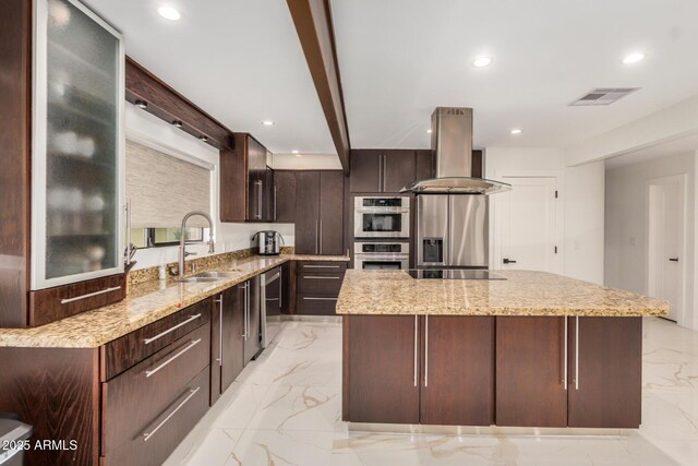 12821 N 67th St, Scottsdale, AZ 85254 - kitchen featuring island exhaust hood, a sink, appliances with stainless steel finishes, light marble finish flooring, and a kitchen island