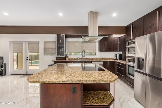 12821 N 67th St, Scottsdale, AZ 85254 - kitchen with stainless steel appliances, a sink, light marble finish floors, a kitchen island, and dark brown cabinetry