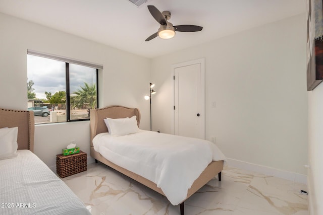12821 N 67th St, Scottsdale, AZ 85254 - bedroom with light marble finish flooring, a ceiling fan, and baseboards