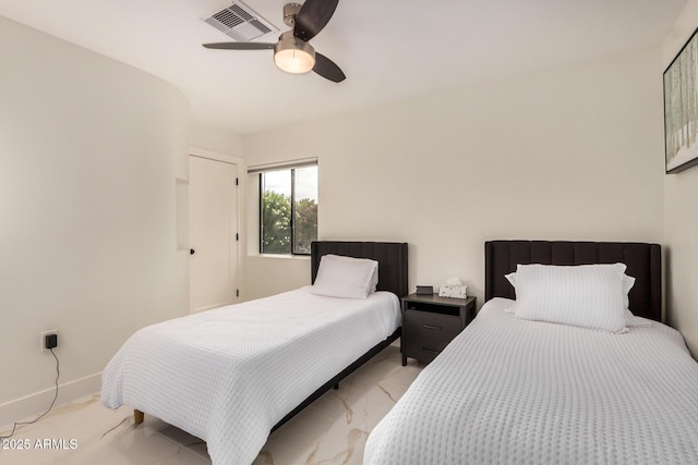 12821 N 67th St, Scottsdale, AZ 85254 - bedroom with light marble finish flooring, ceiling fan, and baseboards