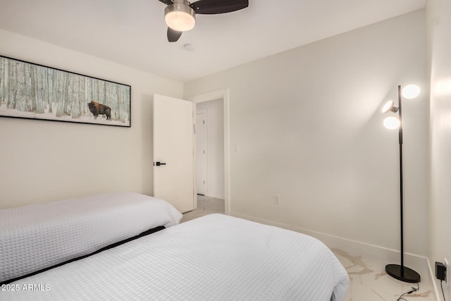 12821 N 67th St, Scottsdale, AZ 85254 - bedroom with light marble finish flooring, ceiling fan, and baseboards