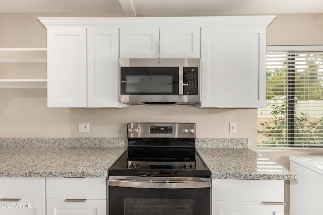 12821 N 67th St, Scottsdale, AZ 85254 - kitchen with stainless steel appliances, white cabinets, open shelves, and light stone countertops
