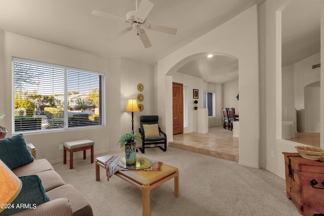 living room with ceiling fan and light carpet