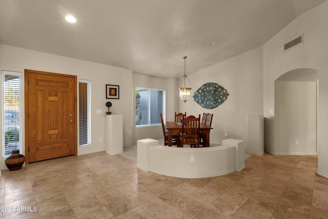 entryway with vaulted ceiling