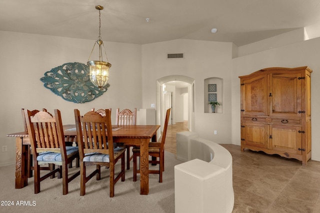 dining space featuring lofted ceiling