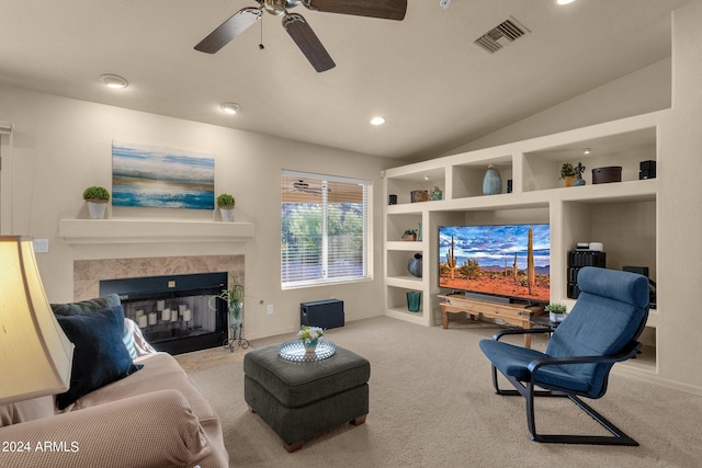 living room with light colored carpet, lofted ceiling, and ceiling fan