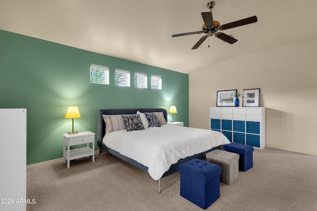 bedroom featuring lofted ceiling, ceiling fan, and carpet