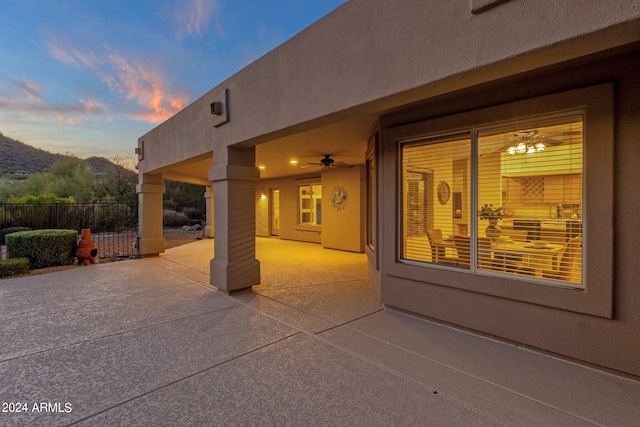 patio terrace at dusk with ceiling fan