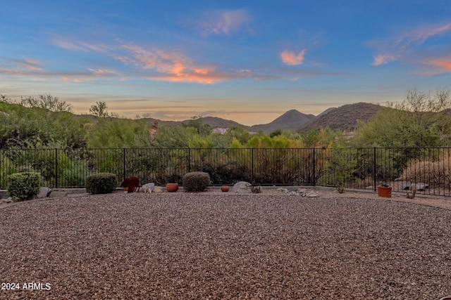 yard at dusk with a mountain view