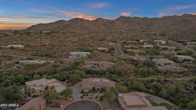 aerial view at dusk with a mountain view