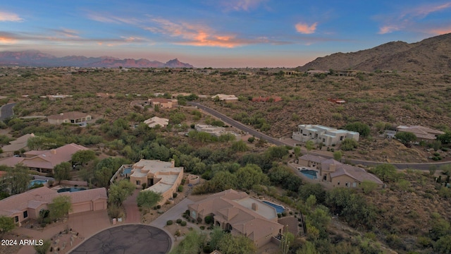 aerial view at dusk with a mountain view