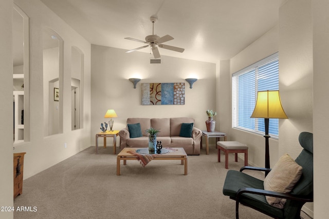 carpeted living room featuring ceiling fan