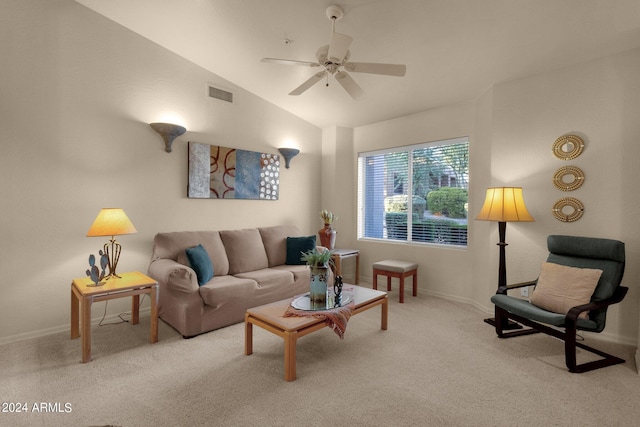 living room with lofted ceiling, ceiling fan, and light colored carpet