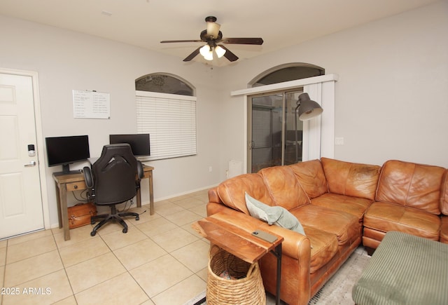 office space featuring light tile patterned flooring and ceiling fan