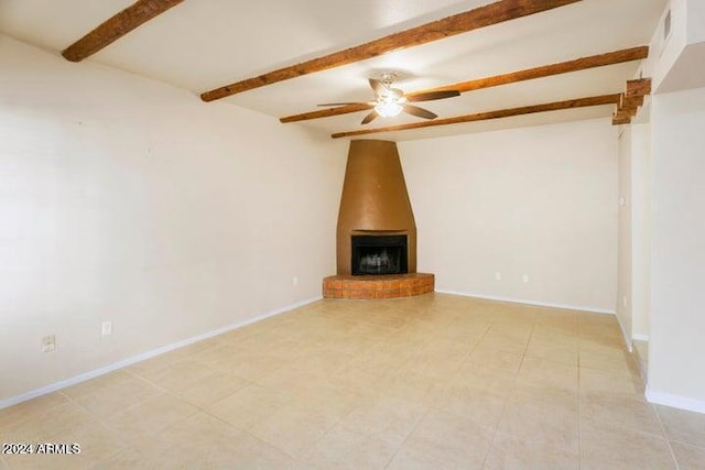 unfurnished living room featuring a wood stove, beamed ceiling, ceiling fan, and light tile patterned floors