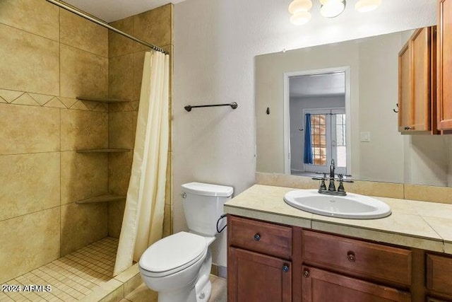 bathroom with vanity, toilet, and a shower with curtain