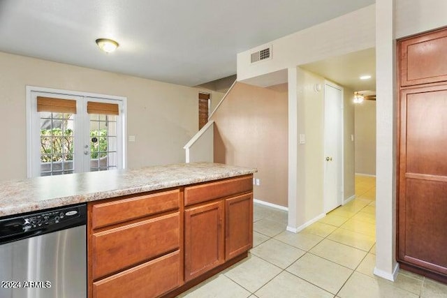 kitchen featuring french doors, dishwasher, and light tile patterned floors