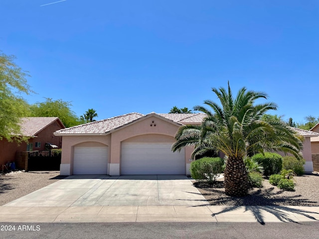 view of front of property featuring a garage